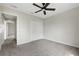 Carpeted bedroom featuring a double-door closet and neutral walls and trim at 583 Drayton Rd, Winter Haven, FL 33884