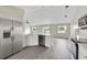 Open kitchen featuring stainless steel appliances, a dishwasher, and white cabinets at 583 Drayton Rd, Winter Haven, FL 33884
