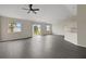 Spacious living room with hard surface floors and large windows overlooking the backyard at 583 Drayton Rd, Winter Haven, FL 33884