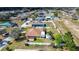 Aerial shot of backyard featuring well-maintained lawn and privacy fence at 625 Hatchwood Dr, Haines City, FL 33844