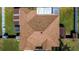 Bird's eye view of house with brown roof, well maintained lawn, and privacy fence at 625 Hatchwood Dr, Haines City, FL 33844
