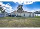 The backyard has a screened lanai, and lush landscaping, creating a tranquil retreat at 625 Hatchwood Dr, Haines City, FL 33844
