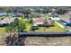 Aerial view of a home's backyard showing the landscaping, lawn, and fenced perimeter at 625 Hatchwood Dr, Haines City, FL 33844