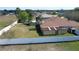 Large, fenced backyard featuring a well-maintained lawn, providing ample space for activities at 625 Hatchwood Dr, Haines City, FL 33844