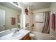 Well-maintained bathroom with vanity, toilet, and shower-tub combination at 625 Hatchwood Dr, Haines City, FL 33844