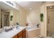 Bright bathroom boasting separate shower and soaking tub with tile surround at 625 Hatchwood Dr, Haines City, FL 33844