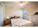 Bedroom featuring a ceiling fan, window, and comfortable furnishings at 625 Hatchwood Dr, Haines City, FL 33844