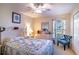Bright bedroom offers a ceiling fan, natural light, and comfortable furnishings at 625 Hatchwood Dr, Haines City, FL 33844