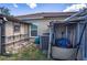 Exterior shot showing an AC unit next to a house and covered storage at 625 Hatchwood Dr, Haines City, FL 33844