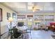Inviting Florida room with tile floors, large windows, and casual furniture at 625 Hatchwood Dr, Haines City, FL 33844