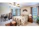 Comfortable bedroom features natural light, ceiling fan and relaxing décor at 625 Hatchwood Dr, Haines City, FL 33844