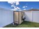 Image of a shed against a white fence, showing backyard storage at 625 Hatchwood Dr, Haines City, FL 33844