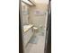 Neat bathroom with vanity, toilet, tile floor, and decorative artwork on the walls at 703 Eagle Pond Dr # 703, Winter Haven, FL 33884