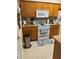 Functional kitchen with essential appliances and ample cabinet space at 703 Eagle Pond Dr # 703, Winter Haven, FL 33884