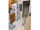 Bright kitchen with clean white refrigerator, cabinets and appliances at 703 Eagle Pond Dr # 703, Winter Haven, FL 33884