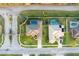 Bird's eye view of neighboring homes with pools and well-maintained landscaping in a gated community at 7327 Bent Grass Dr, Winter Haven, FL 33884