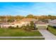 Inviting single-story home featuring lush landscaping, a well-maintained lawn, and attached two-car garage at 7327 Bent Grass Dr, Winter Haven, FL 33884