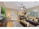 Inviting living room with open layout, ceiling fan, and neutral color palette at 7327 Bent Grass Dr, Winter Haven, FL 33884