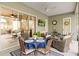Screened patio featuring a dining table, comfortable seating, and a mounted television at 7327 Bent Grass Dr, Winter Haven, FL 33884