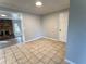 Spacious dining room with tile flooring, connecting to the living area with a fireplace at 909 Spirit Lake Rd, Winter Haven, FL 33880