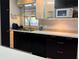 Stylish kitchen with black and white cabinets, providing ample storage and a modern feel at 909 Spirit Lake Rd, Winter Haven, FL 33880