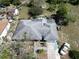 Birds eye view of a home highlighting the roof and the surrounding landscaping at 915 Exmoor Way, Lake Wales, FL 33853