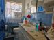 A blue and white bathroom features a sink and toilet at 915 Exmoor Way, Lake Wales, FL 33853