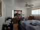 Bedroom featuring hardwood floors, ceiling fan and closet at 915 Exmoor Way, Lake Wales, FL 33853