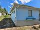 The side of a light blue single story home under a blue sky at 915 Exmoor Way, Lake Wales, FL 33853