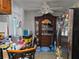 Eat-in kitchen features a refrigerator, dining table and chairs and a cabinet at 915 Exmoor Way, Lake Wales, FL 33853