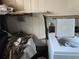 A utility room featuring a washing machine and a utility sink at 915 Exmoor Way, Lake Wales, FL 33853