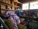 Interior of a wooden shed cluttered with items and exposed wooden beams at 915 Exmoor Way, Lake Wales, FL 33853