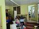 Storage Room featuring yellow walls, tile floors and stairs at 915 Exmoor Way, Lake Wales, FL 33853