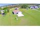 Aerial view of the property, showcasing a charming home, extensive yard, and defined property lines at 990 Brooke Rd, Fort Meade, FL 33841