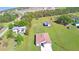 Property aerial view, highlighting the home, outbuilding and expansive lot with outlined property boundaries at 990 Brooke Rd, Fort Meade, FL 33841