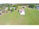 Expansive aerial view of a property with a well-maintained lawn and a home with an attached two car garage at 990 Brooke Rd, Fort Meade, FL 33841