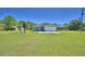 Well-maintained home on a large lot with a spacious front yard and long driveway at 990 Brooke Rd, Fort Meade, FL 33841