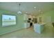Well-lit kitchen featuring stainless steel appliances, white cabinets, and quartz countertops at 990 Brooke Rd, Fort Meade, FL 33841