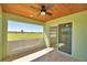 Relaxing screened lanai featuring tongue and groove wood ceiling, tile flooring and a beautiful view of the surrounding acreage at 990 Brooke Rd, Fort Meade, FL 33841