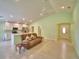Open-concept living space featuring tiled floors, neutral decor, and modern fixtures at 990 Brooke Rd, Fort Meade, FL 33841