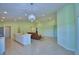 Open living area showcases the kitchen, dining area, and main living space, with vaulted ceilings and light-colored tile flooring at 990 Brooke Rd, Fort Meade, FL 33841