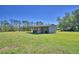 Outbuilding with lean-to offers additional covered space and storage at 990 Brooke Rd, Fort Meade, FL 33841