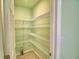 Walk-in pantry with ample wire shelving and easy access for organized storage at 990 Brooke Rd, Fort Meade, FL 33841
