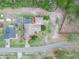 Aerial of home showcasing backyard pool and driveway at 100 Heatherwood Blvd, Lake Wales, FL 33859