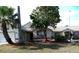Charming single Gathering home with mature trees and front yard landscaping at 100 Heatherwood Blvd, Lake Wales, FL 33859