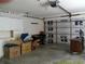 This large garage features storage cabinets and access to garage door at 100 Heatherwood Blvd, Lake Wales, FL 33859