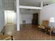 Bright living room features neutral walls, laminated floors, ceiling fan and a charming collection of traditional furniture at 100 Heatherwood Blvd, Lake Wales, FL 33859
