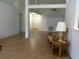 The living room features laminated floors and neutral-toned walls; the front door is visible in the background at 100 Heatherwood Blvd, Lake Wales, FL 33859
