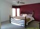 The main bedroom showcases plenty of room and a large window at 100 Heatherwood Blvd, Lake Wales, FL 33859