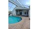 Enjoy the sparkling pool and patio area, perfect for outdoor entertaining at 100 Heatherwood Blvd, Lake Wales, FL 33859